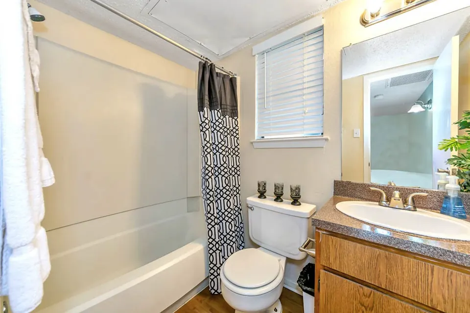 Full bathroom with a tub and shower