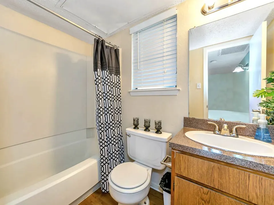 Full bathroom with a tub and shower