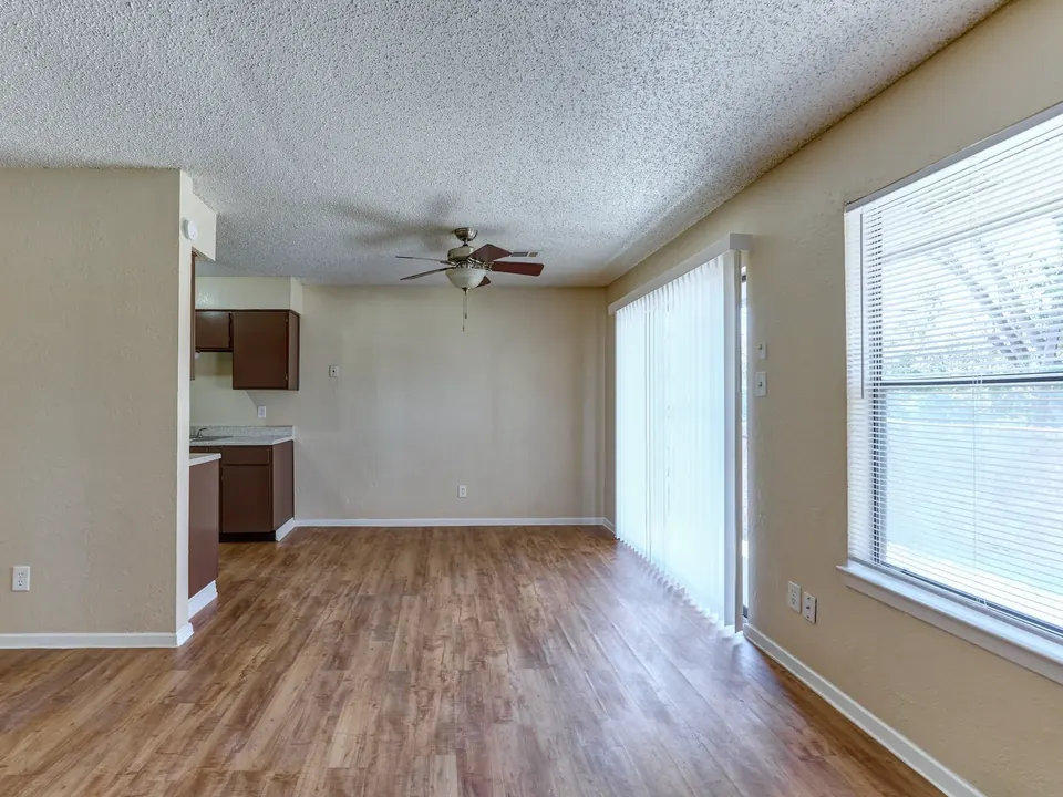 Open kitchen and dining area with a ceiling fan