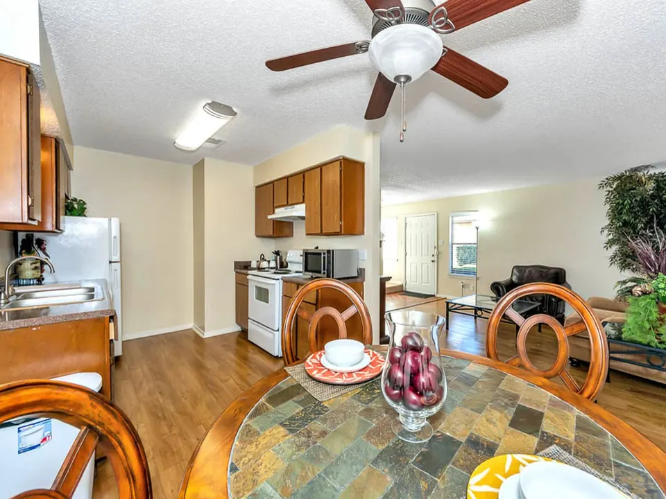 Dining area open to the kitchen and living room in a White Oak townhome