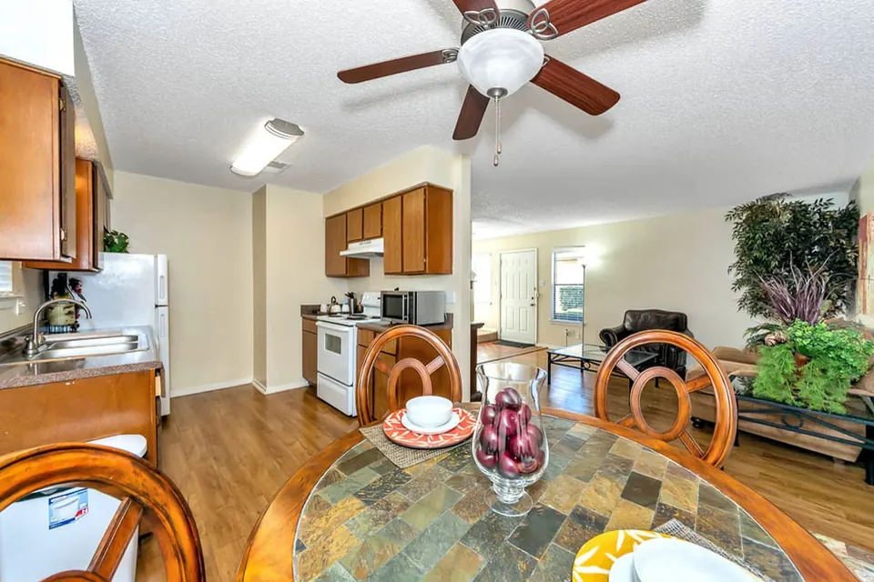 Dining area open to the kitchen and living room in a White Oak townhome