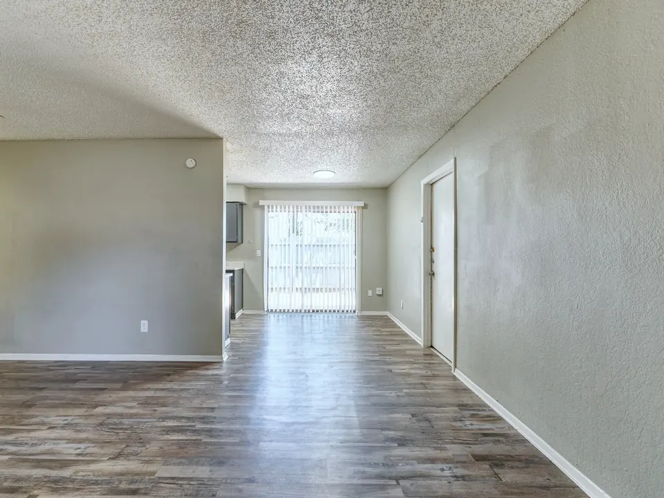 Open living area with vinyl plank floors in a renovated Modern Grey townhome